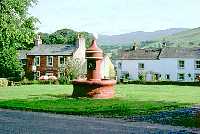 Fountain on Village Green, Dufton with Stag Inn behind
