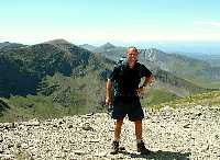 On summit of Carnedd Llewelyn, with Carnedd Dafydd and Elidir Fawr behind